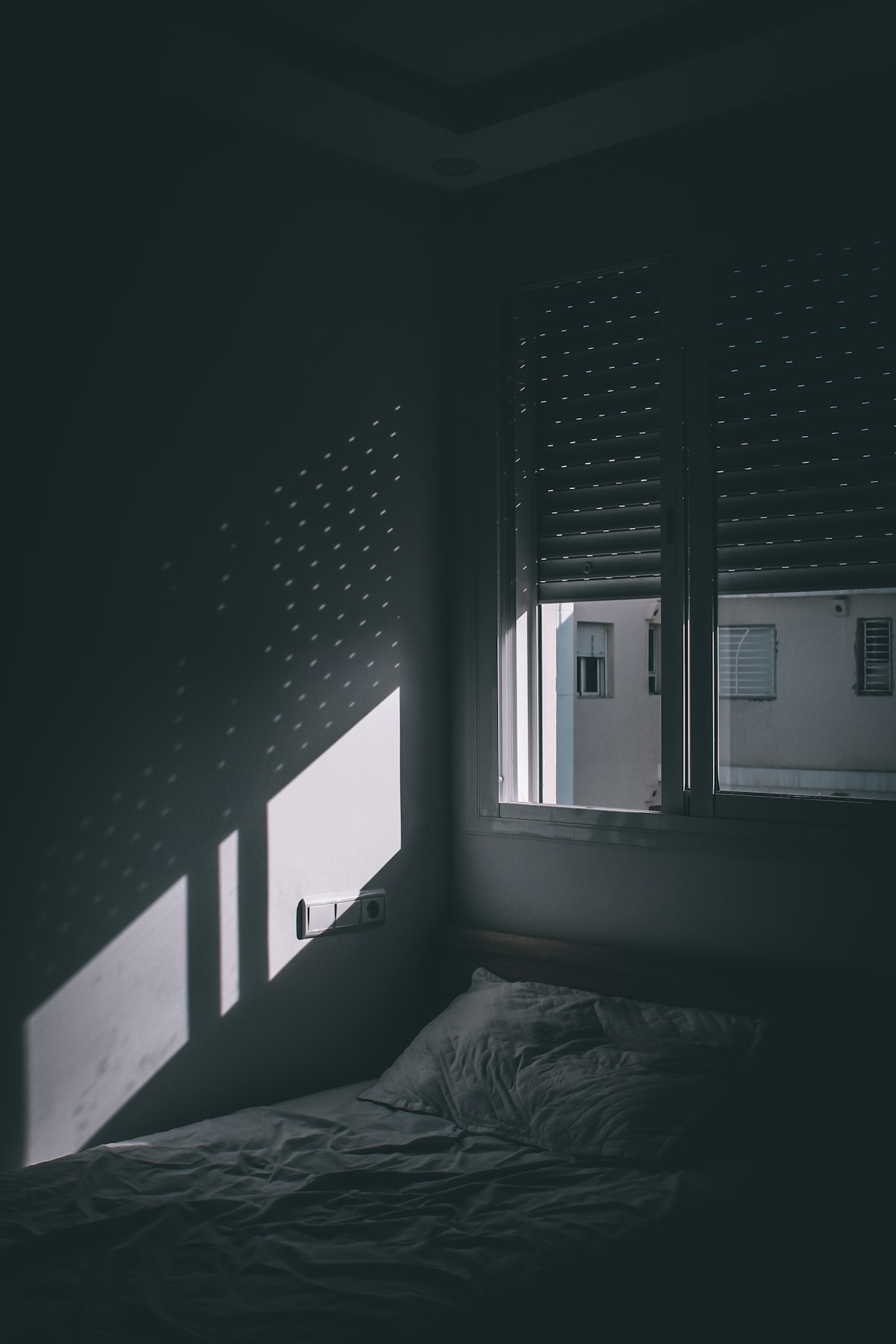 Morning sunlight falling across a made bed - the 10-3-2-1-0 sleep rule explained