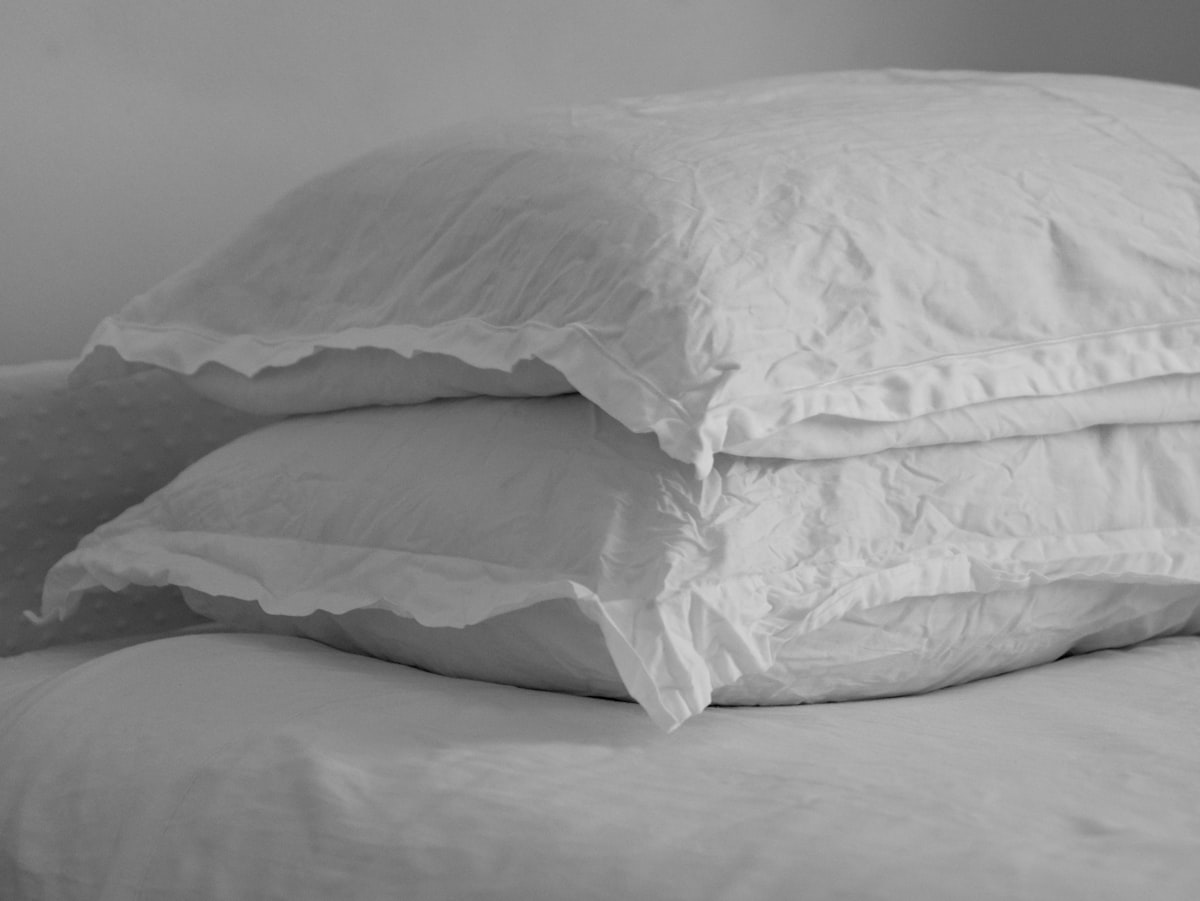 Pillowcases on a bed made up for a cool night - best cooling pillowcases UK