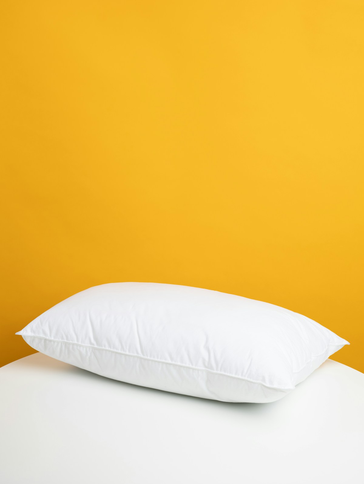 White pillow on a bed - best CPAP pillows UK 2026