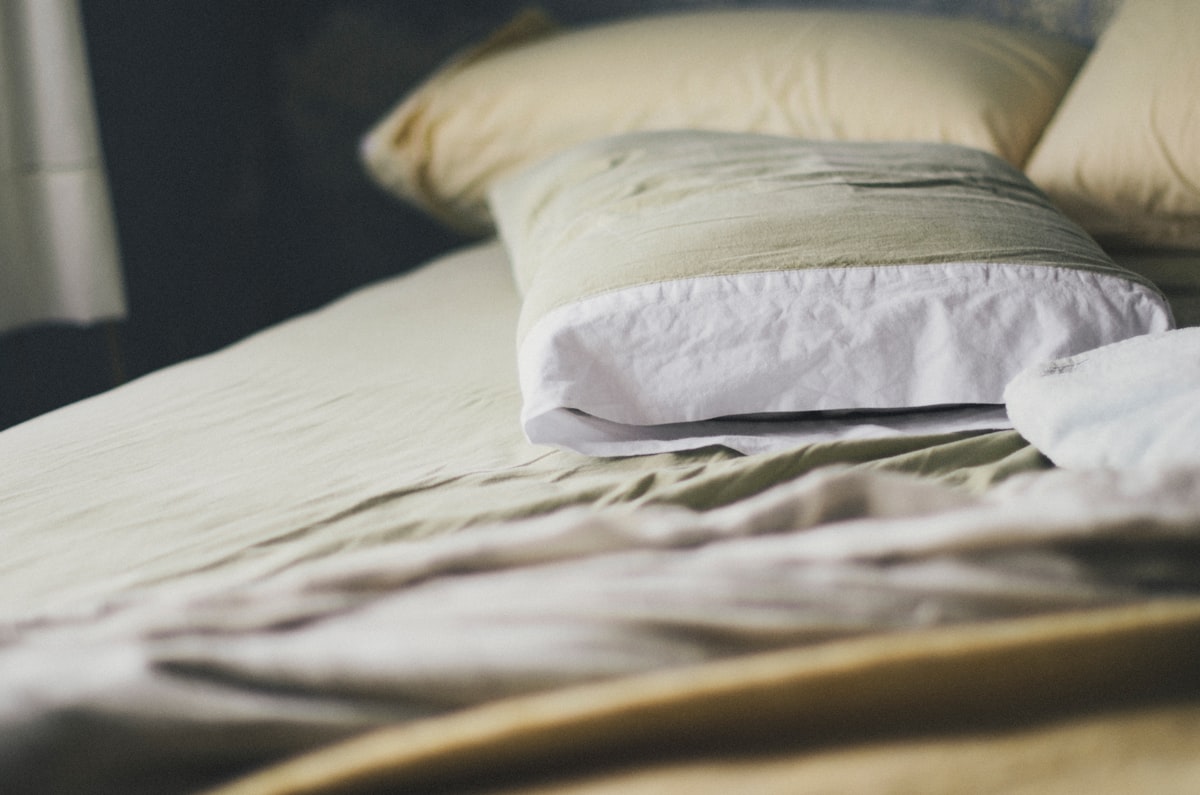 A calm bedroom with pillows on a made bed - best wedge pillows UK 2026