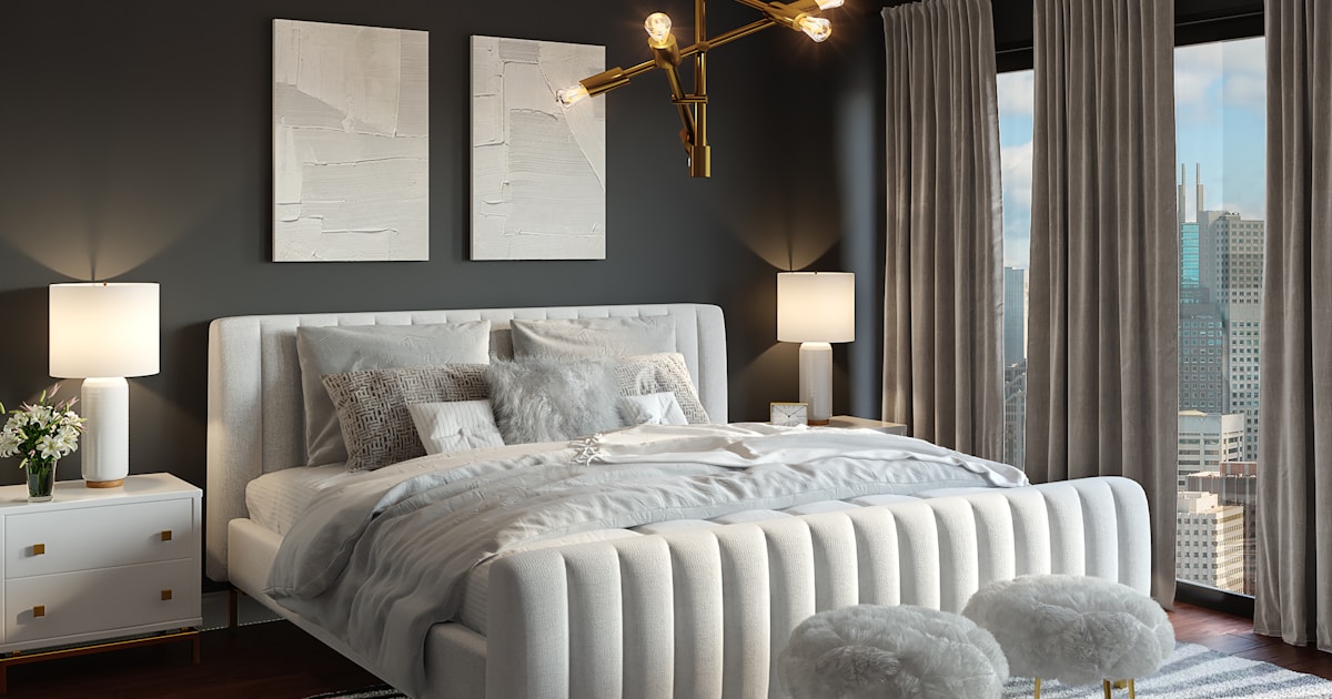 A desk fan providing airflow in a bedroom on a warm summer night
